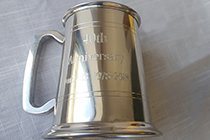AN ANNIVERSERY MESSAGE ENGRAVED ON A TANKARD
