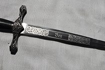 A CELTIC DECORATION ON A CELTIC DAGGER